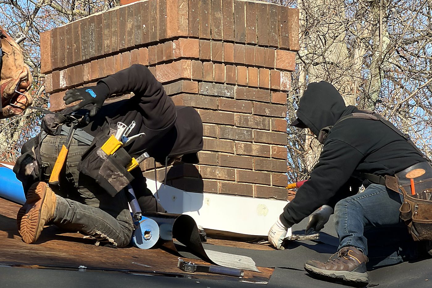 Chimney flashing — New step and counter-flashing worked into the brick.
